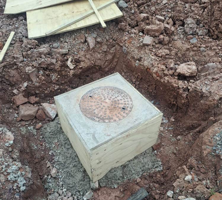 Man holes dug out new risers put on and concrete around – Barn Conversion